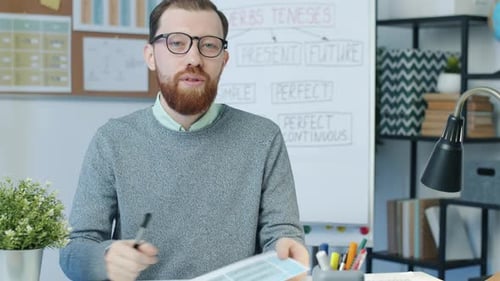 Man Teaching English Grammar Lesson Online