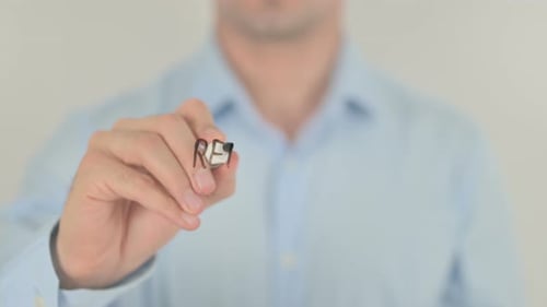 Man Writes Renewable Energy on Clear Surface