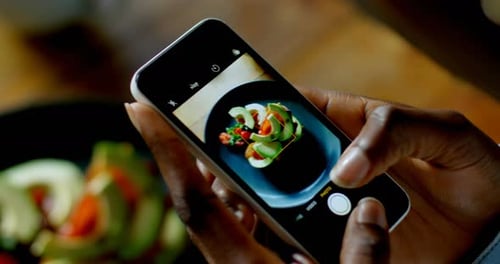 Woman taking picture of food 4k