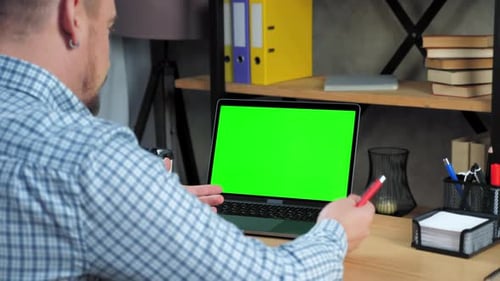 Green screen laptop concept: Man teacher listen tells teaches online video call