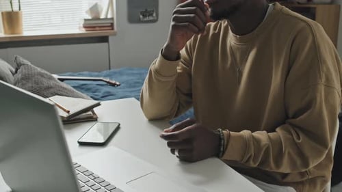 Young Adult Talking on Laptop Video Call