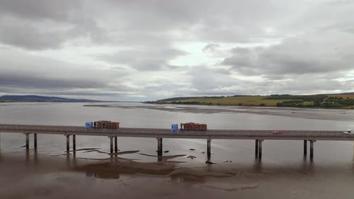 Forestry and logging operations taking place in the highlands of Scotland using large industrial mac