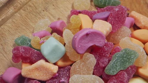 Colorful Candy Assortment on Rustic Wood Surface