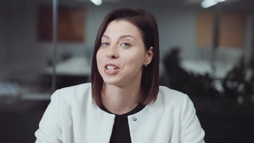 Woman Talking During Online Business Conference in Office