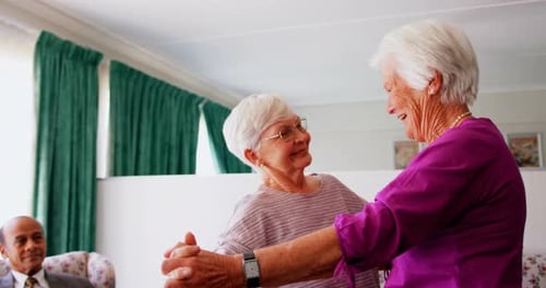 Side view of active Caucasian female senior women dancing together at nursing home 4k