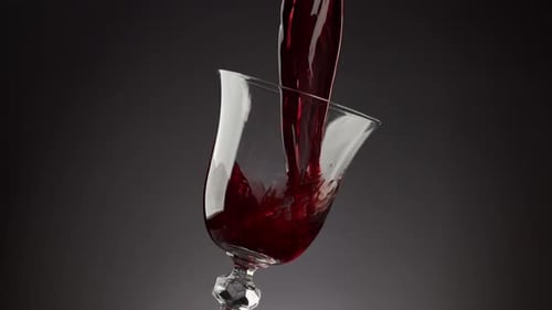 Red Wine Pouring into a Glass