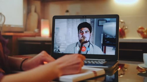 Woman Telemedicine Call with Online Doctor, Taking Notes
