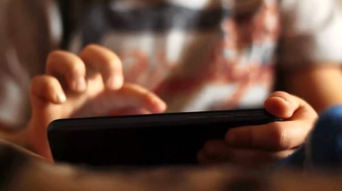 Child Using Smartphone, Close Up on Hands and Phone