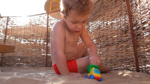 Child Playing on Beach