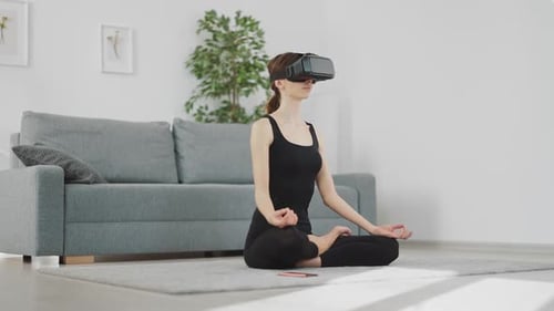 Woman Meditating with VR Headset in Bright Home