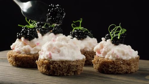 Caviar being added to Appetizer Canape