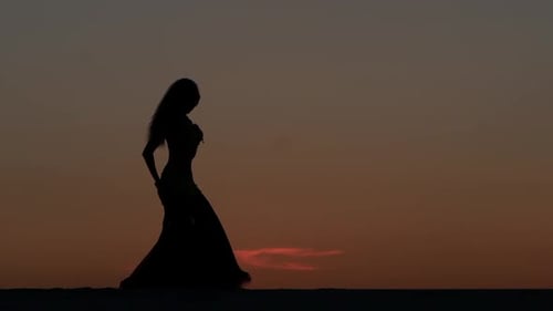 Graceful Movements of a Dancer, Dancing Belly Dance While on the Beach. Silhouettes
