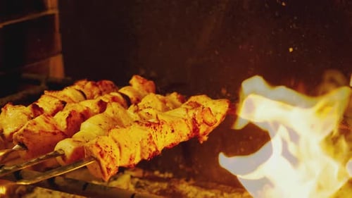 Juicy Meat Skewers Cooking over a Fire