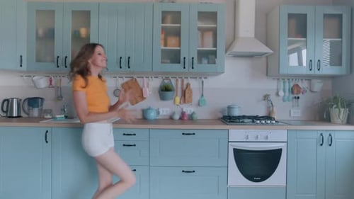 Woman Dancing in Kitchen