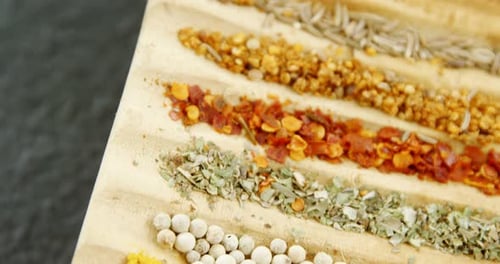Variety of Spices on Wooden Board