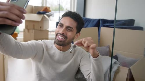 Young Adult Taking Selfie With New House Keys