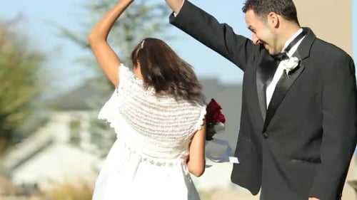 Joyous Couple Dancing at Wedding Celebration