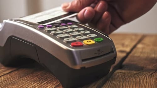Sliding Card Through POS Terminal and Entering Amount