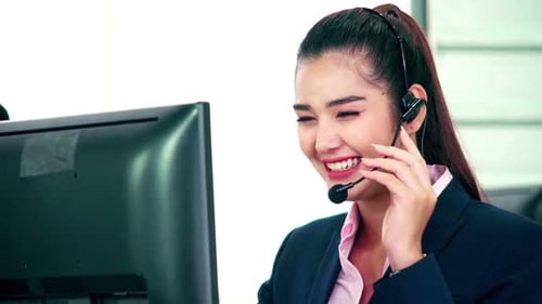 Business People Wearing Headset Working in Office