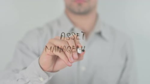 Man Writes 'Asset Management' with Marker