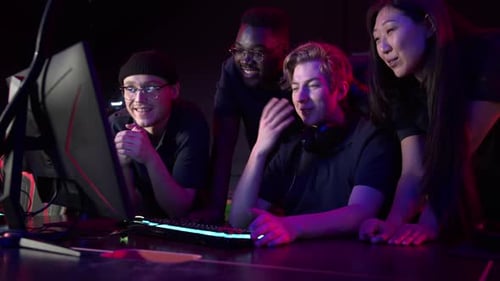 During an Esports Training Session a Team of Boys and Girls Sort Out the Latest Game and Smile