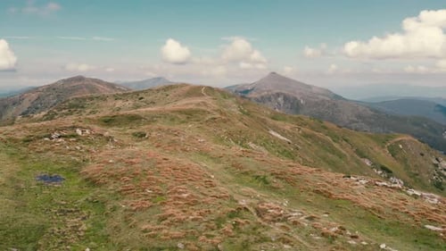 Beautiful Green Mountain Peaks Under Cloudy Sky