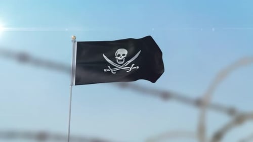 Pirate Flag Waving with Barbed Wire Foreground