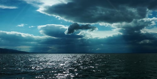 Open Sea Under Cloudy Blue Sky During Daytime