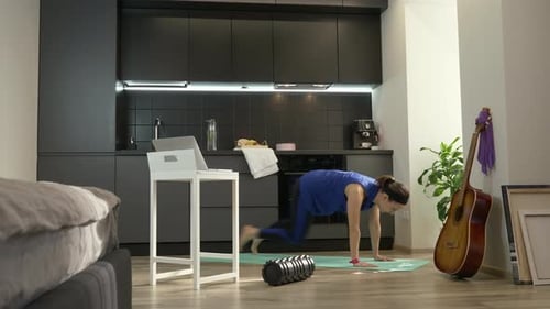 Woman Doing Plank Exercise in her Apartment
