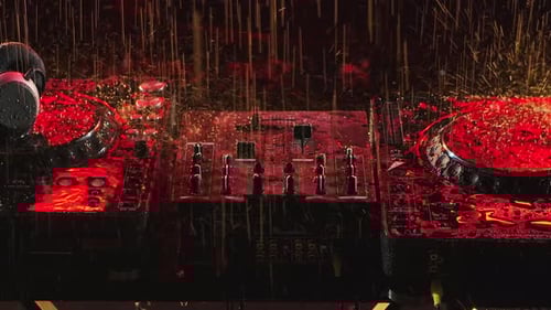 Professional Console Deck Turntable in a Dark Studio. Raindrops Fall on the Instrument in Rays of