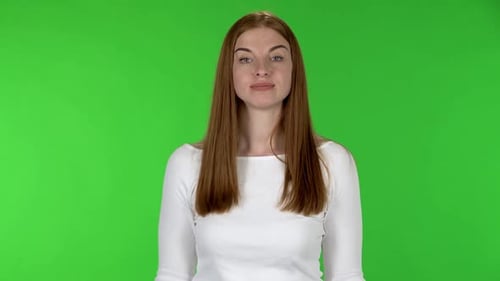 Smiling Woman Makes Peace Sign on Green Screen