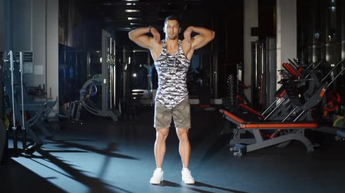 Athletic Man Trains His Hands and Shoulders With Circle Exercises