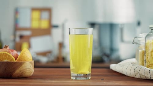 Effervescent Tablet Dissolving in Glass of Water