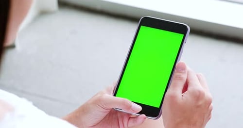 Woman use of mobile phone with chroma key