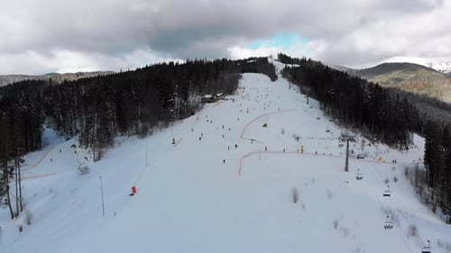 Aerial View on Ski Slopes with Skiers and Ski Lifts on Ski Resort in Winter