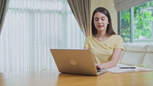 Distance learning of Caucasian Beautiful school girl study virtual online, watching video course.