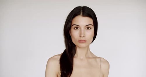 Beautiful Woman Posing with Long Hair in Studio