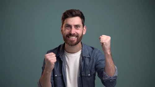 Bearded Man Celebrates Success With Joyful Cheers