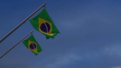 Two Realistic Waving Brazilian Flags Against Blue Sky