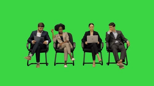 Business Colleagues Getting Ready for a Group Session Having a Casual Talk on a Green Screen Chroma