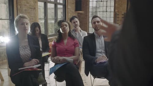 Adults Attending Corporate Lecture in an Urban Office
