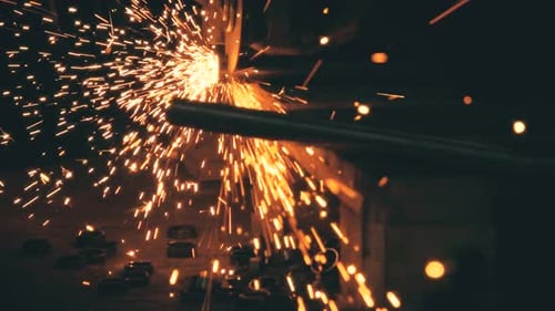 Metal Saw Cuts with Bright Sparks