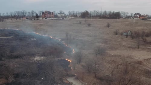 Ecological Problems. Videography of a Village with a Burning Field, Smoke Spreads Across the Field