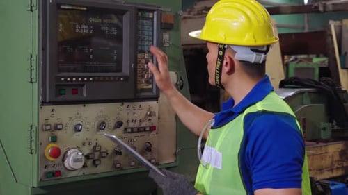 Smart Factory Worker Using Machine in Factory Workshop