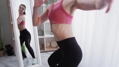 Young Woman Dancing During a Home Workout