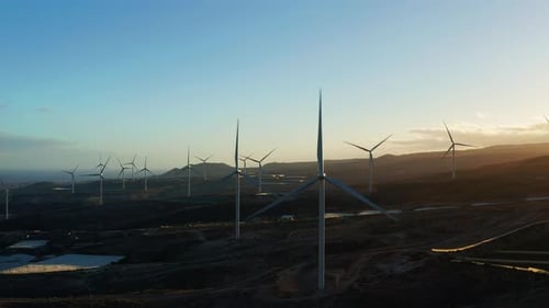 Wind Turbines Farm At Sunset