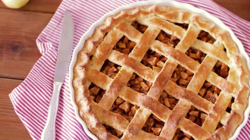 Close Up of Apple Pie and Knife on Wooden Table 1