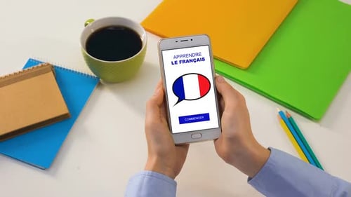 Woman Using French Learning App on Smartphone