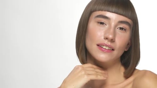 Woman Touching Her Face in a Beauty Close Up