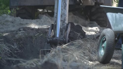 Excavator Digging into the Ground